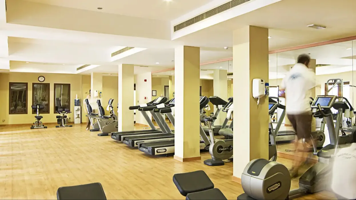 Gym interior with sports equipment at Miramar Al Aqah Beach Resort