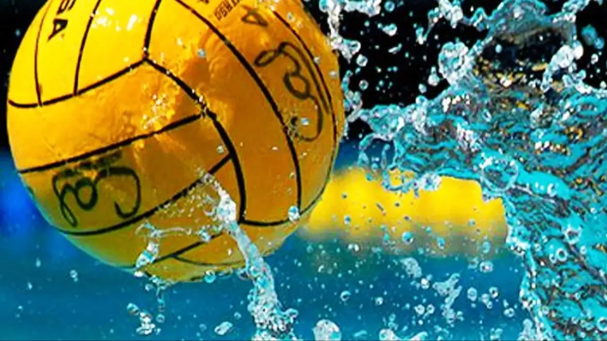 One yellow water polo ball on the water