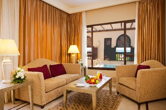 Seating area in the Al Qasr Suite at Miramar Al Aqah Beach Resort